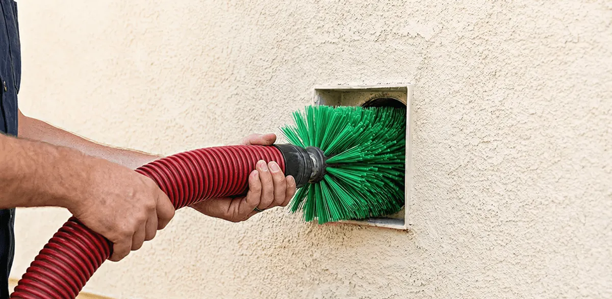 Air duct cleaning brush removing debris from a vent opening in Rochester, NY