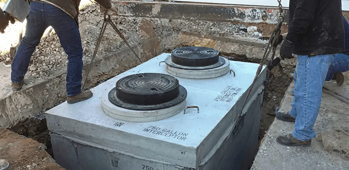Grease trap installation for a commercial property drainage system in Rochester, NY
