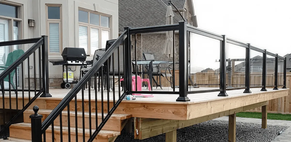 Handrail installation on a deck staircase for safety and code compliance in Rochester, NY